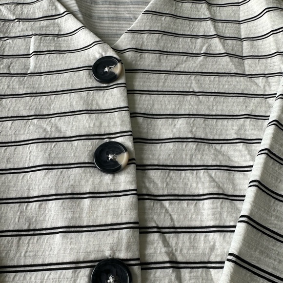 White and black striped shirt with buttons down the front. - Picture 2 of 3